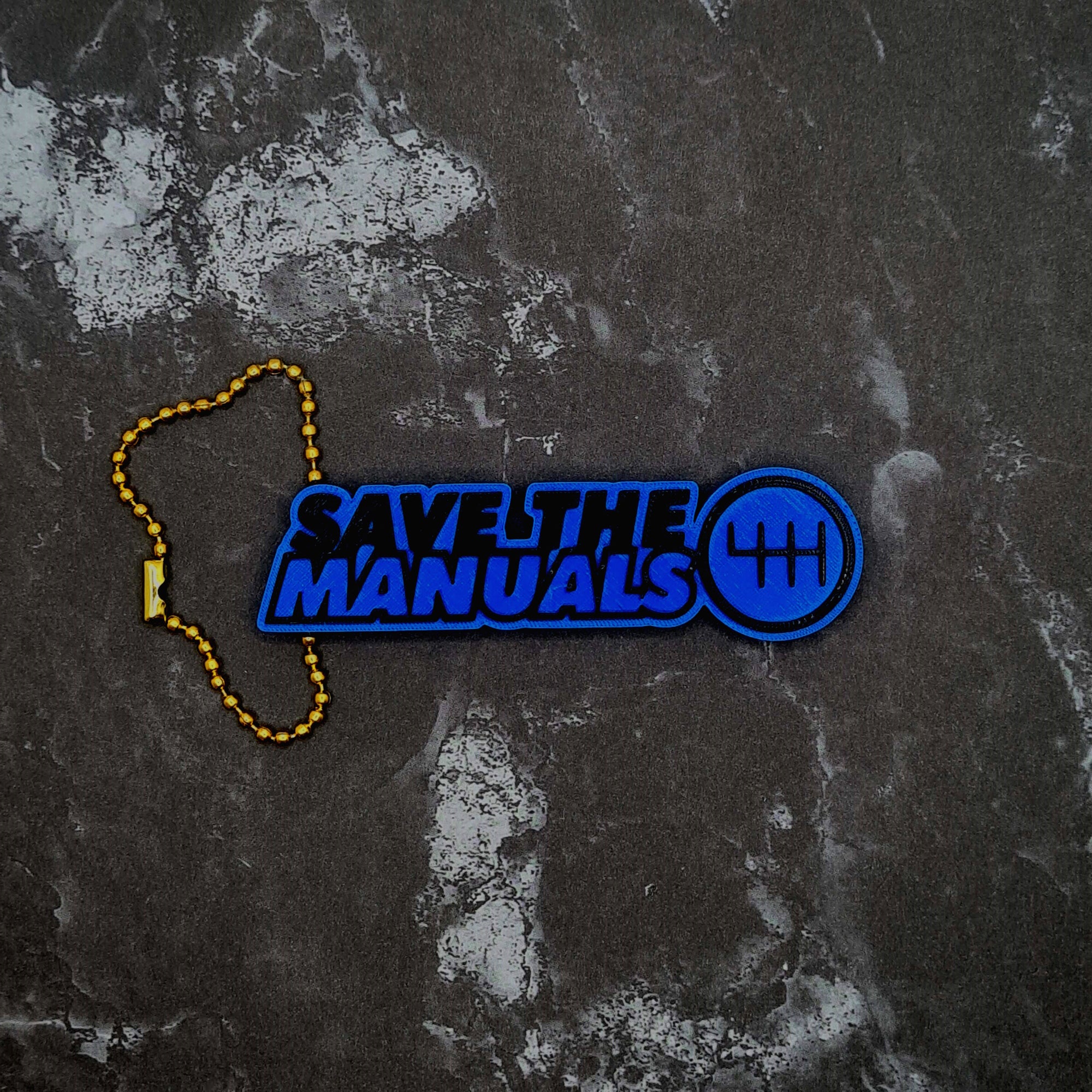 Save the Manuals Keychain!